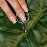 silver circle photo keychain with hidden projection