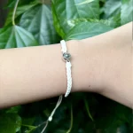 cream rope projection bracelet close-up sentimental jewelry