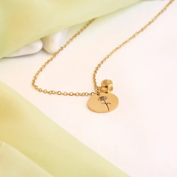 Radiant gold birthflower photo necklace, a heartfelt keepsake to cherish special moments forever.