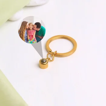 Gold circle photo keychain featuring a hidden projection for a personal, treasured photo.