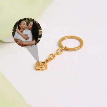 Gold love heart keychain featuring a hidden picture, a timeless keepsake for special moments.