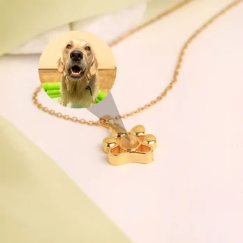 Gold pet paw necklace with a hidden projection photo, keeping cherished pet memories close to heart.