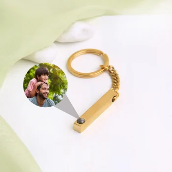 Gold pillar photo keychain engraved with Haven of Jewels, a timeless keepsake to hold special moments and memories.