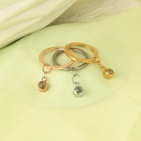 Set of circle photo keychains in silver, gold, and rose gold, designed to hold your most meaningful photos.