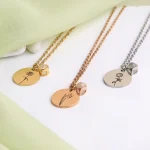 silver birthflower photo necklace close-up intricate detail