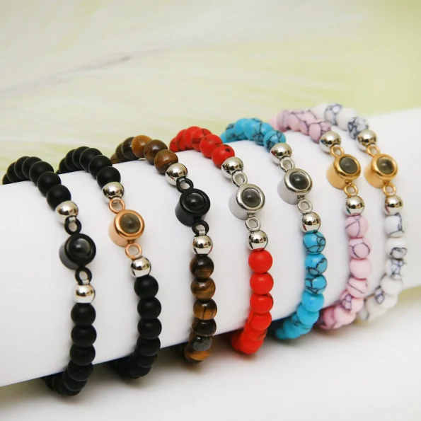 Group shot of frosted photo bracelets in various colors, each holding a secret memory.