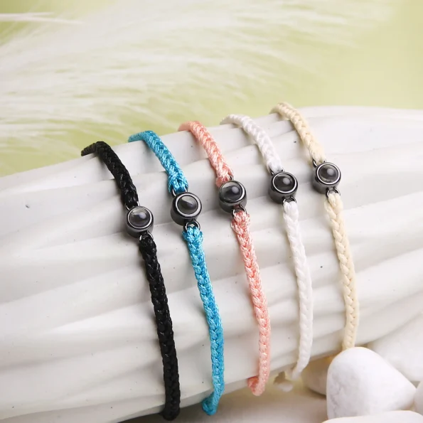 Collection of rope projection bracelets in various colors, each designed to hold a hidden memory.