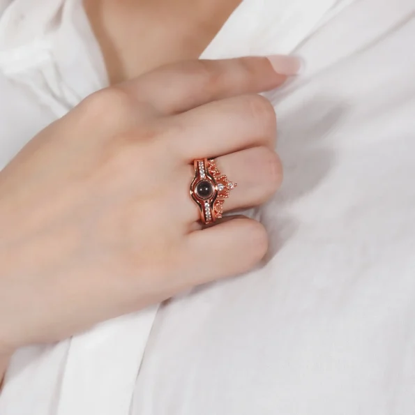 Model wearing a rose gold crown photo ring, a stunning and meaningful jewelry piece with a hidden photo.