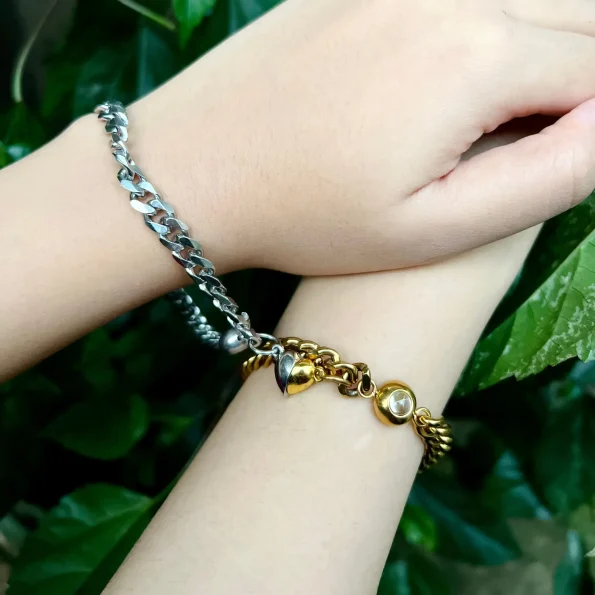 Model wearing a set of 2 Cuban photo bracelets, one silver and one gold, symbolizing timeless connections.