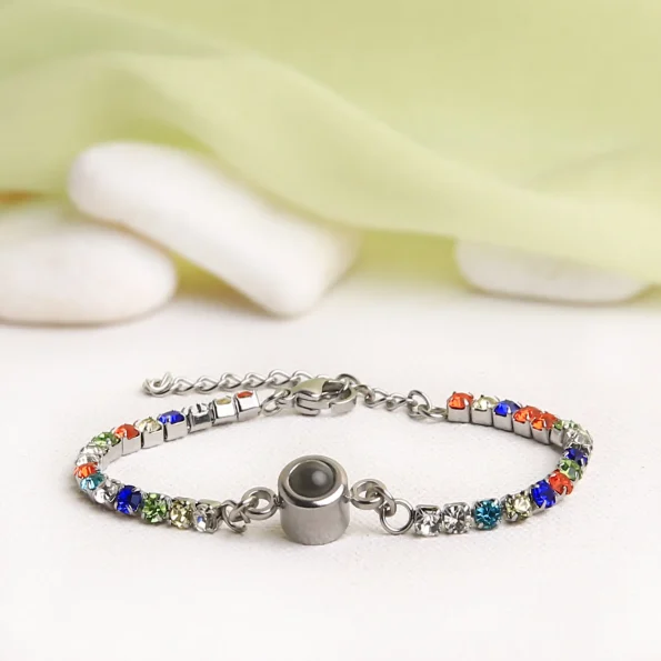Multicolor tennis charm bracelet with hidden projection, designed to hold special memories and celebrate love.