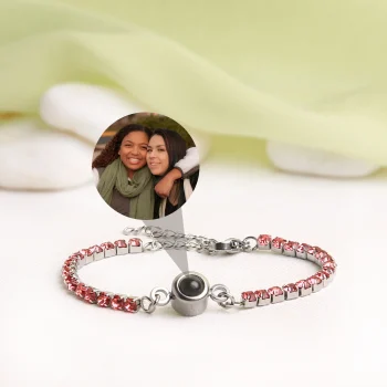 Pink tennis charm bracelet with a hidden projection, a memory keeper to hold your most cherished photos.