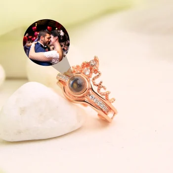Rose gold crown photo ring featuring a hidden projection, a sentimental piece for special moments.