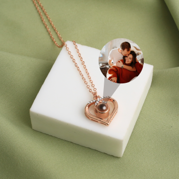 Rose gold heart charm necklace with a secret image inside, a heartfelt tribute to love and connection.
