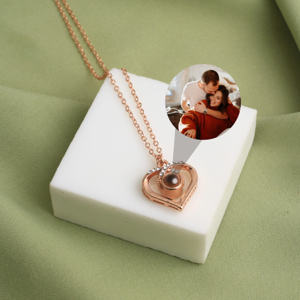Rose gold heart charm necklace with a secret image inside, a heartfelt tribute to love and connection.