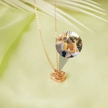 Rose gold heart charm photo necklace with a secret image inside, a symbol of love and connection.