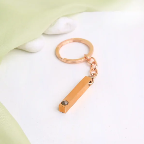 Rose gold pillar photo keychain engraved with Haven of Jewels, a meaningful way to keep precious memories close.