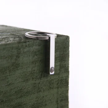 Sleek silver bar photo keychain with a hidden compartment, perfect for keeping your cherished moments close.