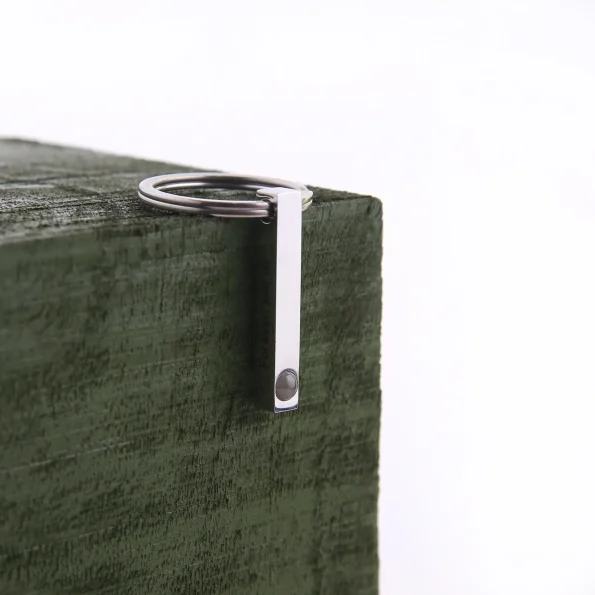 Sleek silver bar photo keychain with a hidden compartment, perfect for keeping your cherished moments close.