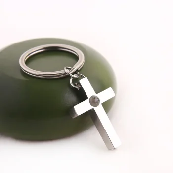 Elegant silver Bible verse cross keychain, a timeless keepsake symbolizing faith and devotion.