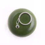 silver circle photo keychain with hidden projection