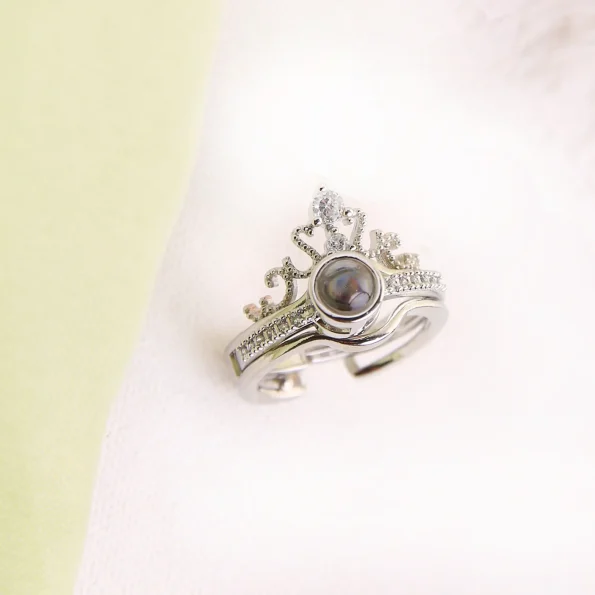Silver crown photo ring with a hidden picture inside, a regal keepsake for treasured memories.