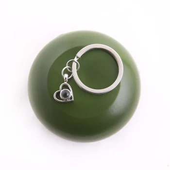 Silver heart-shaped photo keychain, a meaningful way to carry special memories everywhere.