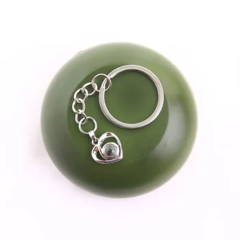 Elegant silver love heart keychain with a hidden photo compartment, perfect for treasured memories.