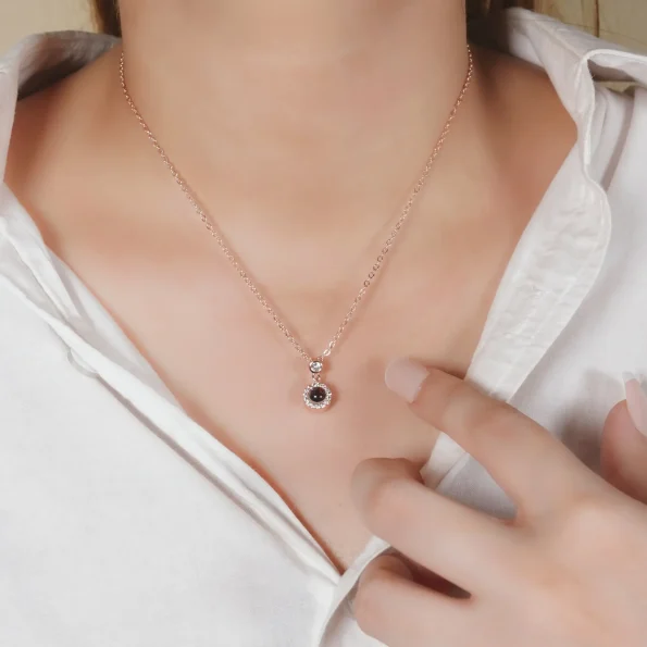 A girl wearing a silver petite halo necklace, adding a touch of refined elegance to her look.