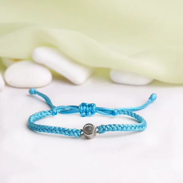 Vibrant teal rope projection bracelet with a unique hidden photo, a stylish and meaningful gift.