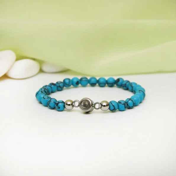 Vibrant turquoise frosted photo bracelet featuring a hidden picture, blending style with sentiment.